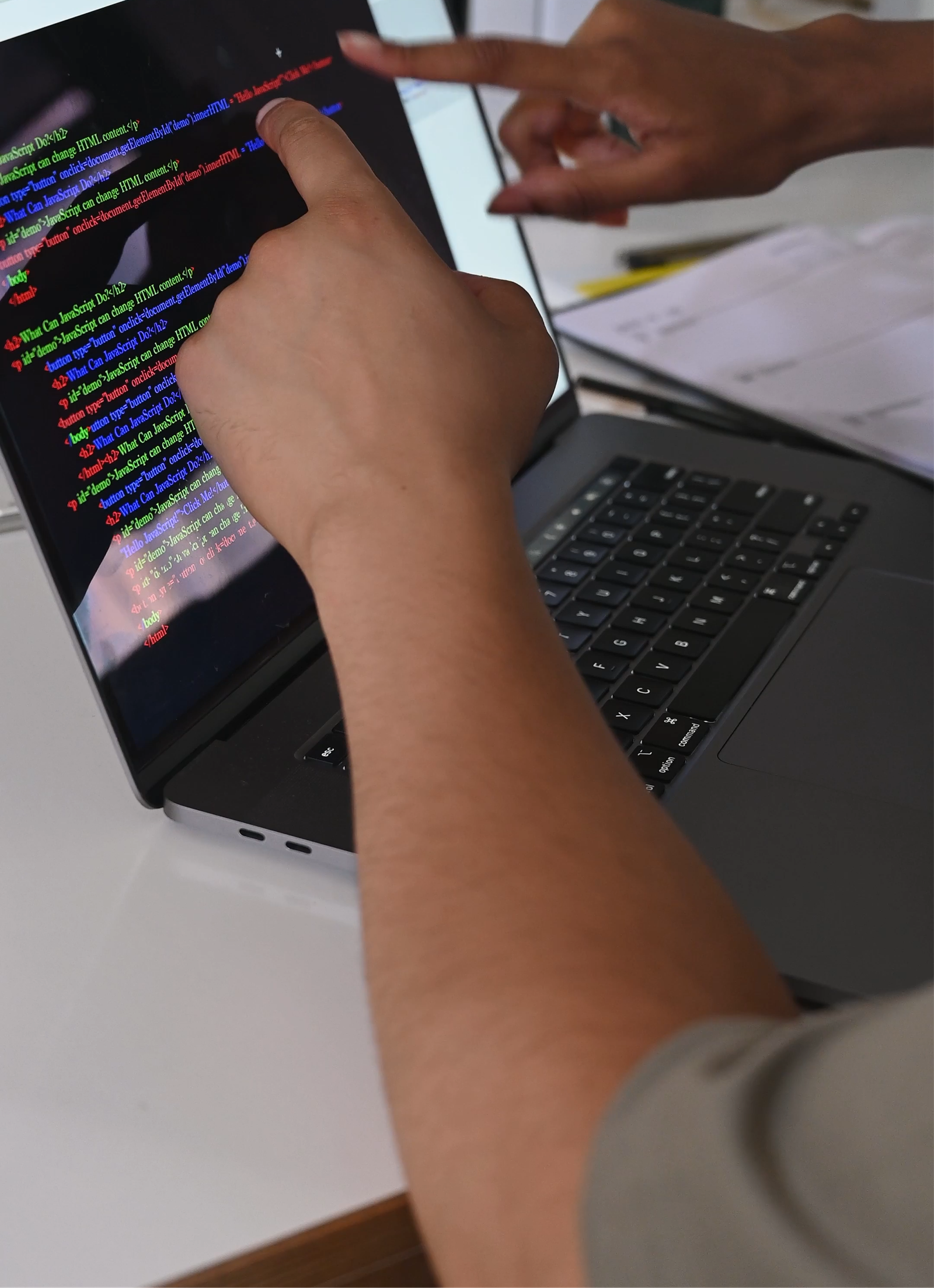 Reviewing software code on a laptop